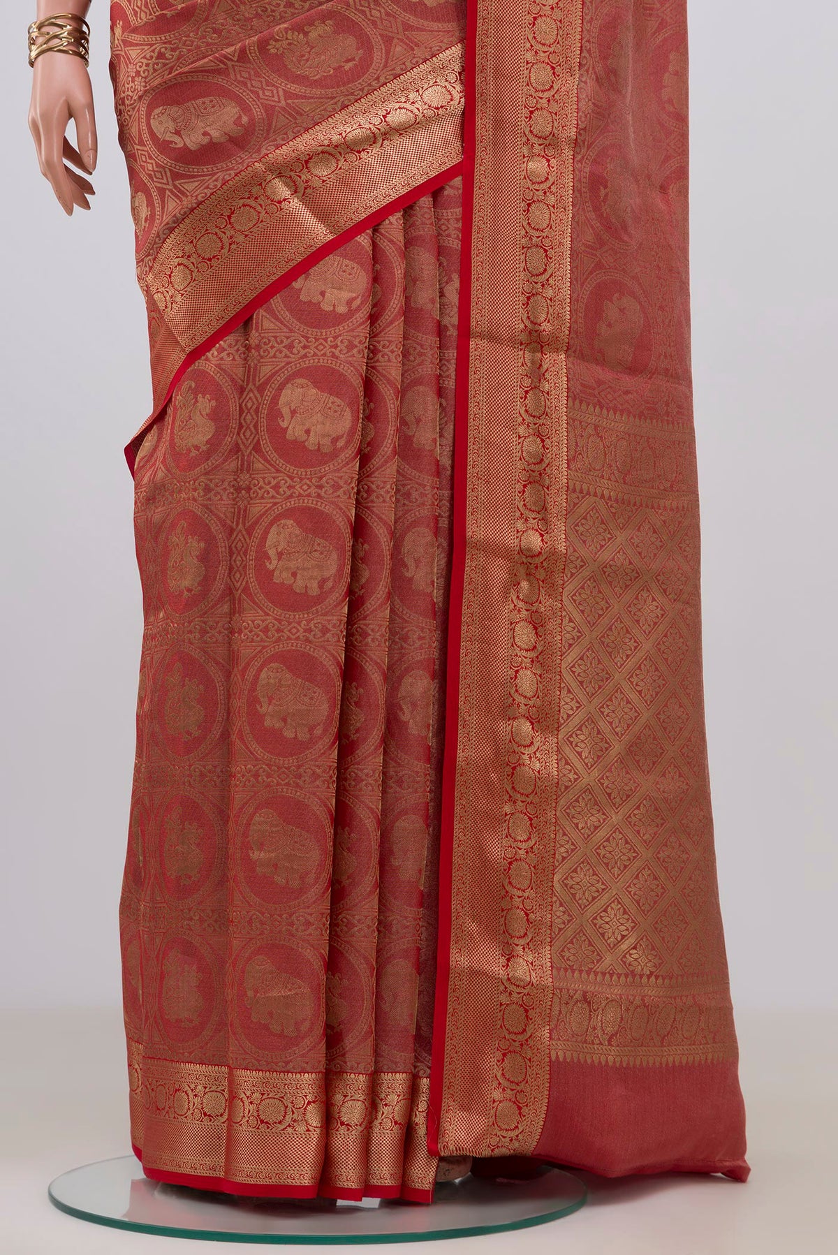 Pleats and pallu of Red Mysore Crepe Saree with Zari Brocade on the body and Zari Border. 