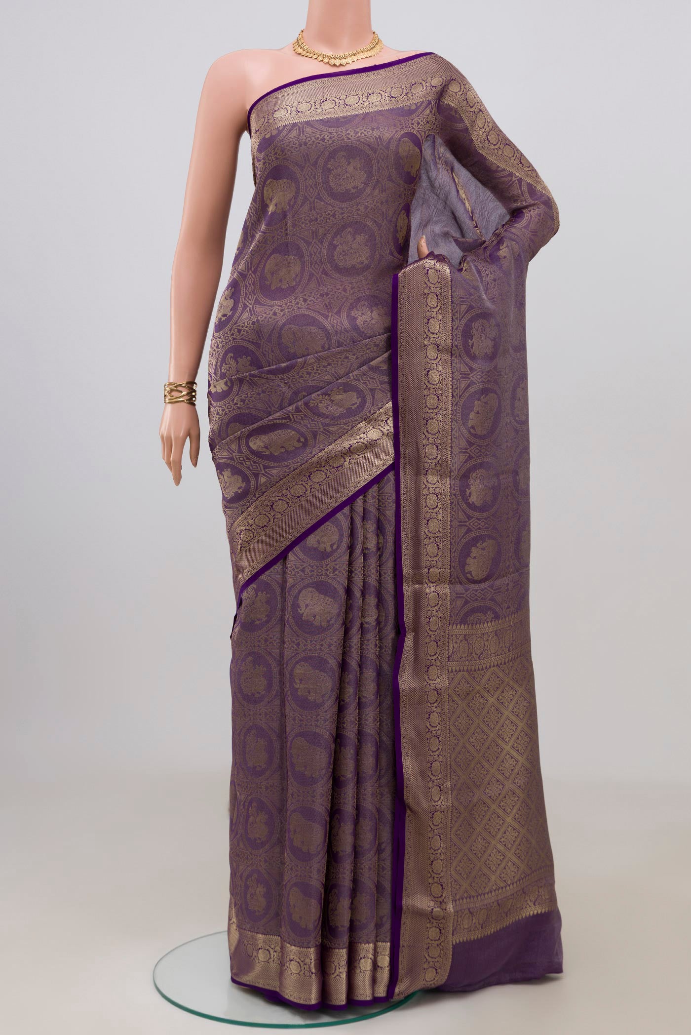 Violet Mysore Crepe Saree with Zari Brocade on the body and Zari Border.  displayed on a mannequin