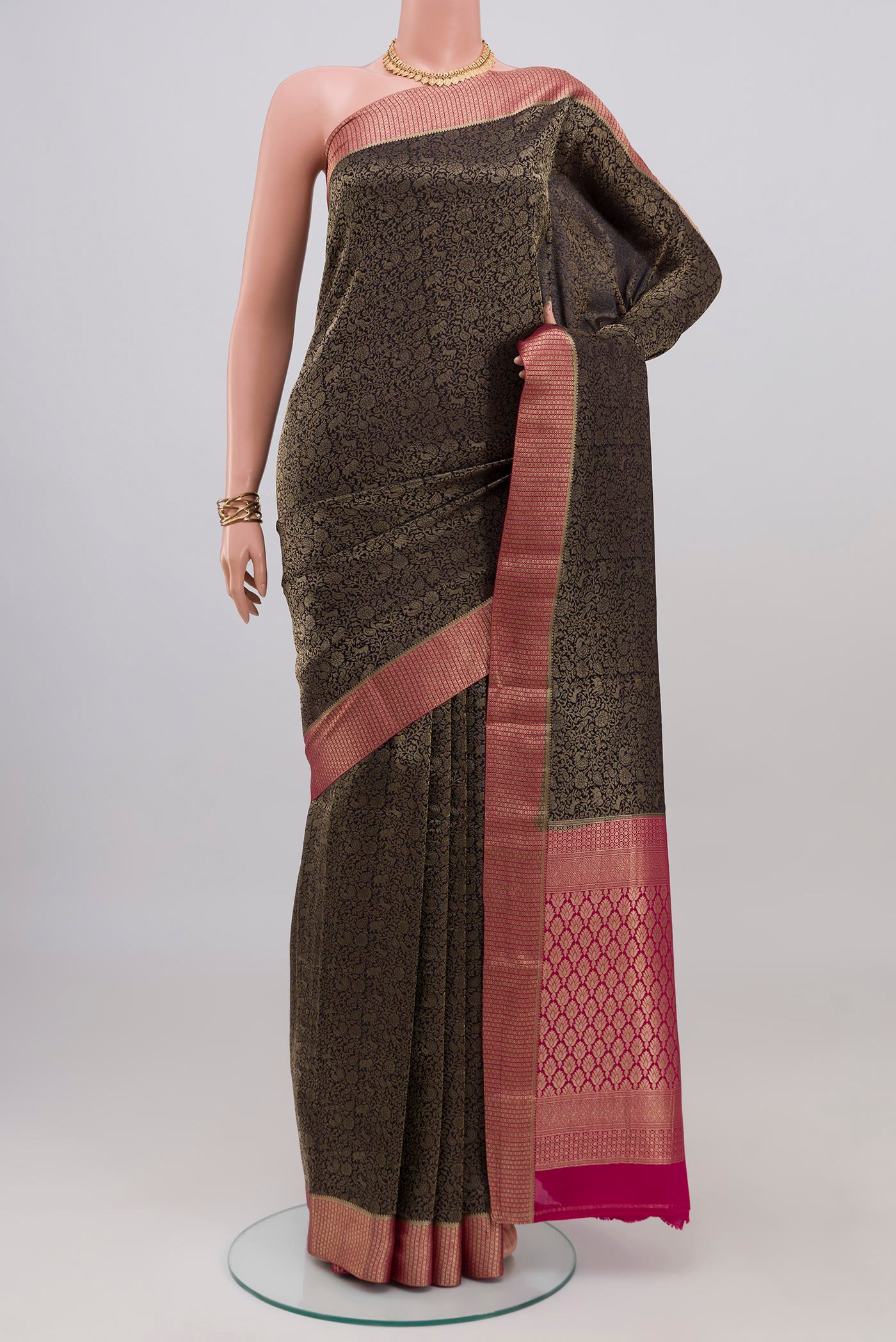 Black Mysore Crepe Saree with Zari Brocade on the body and Zari Border.  displayed on a mannequin