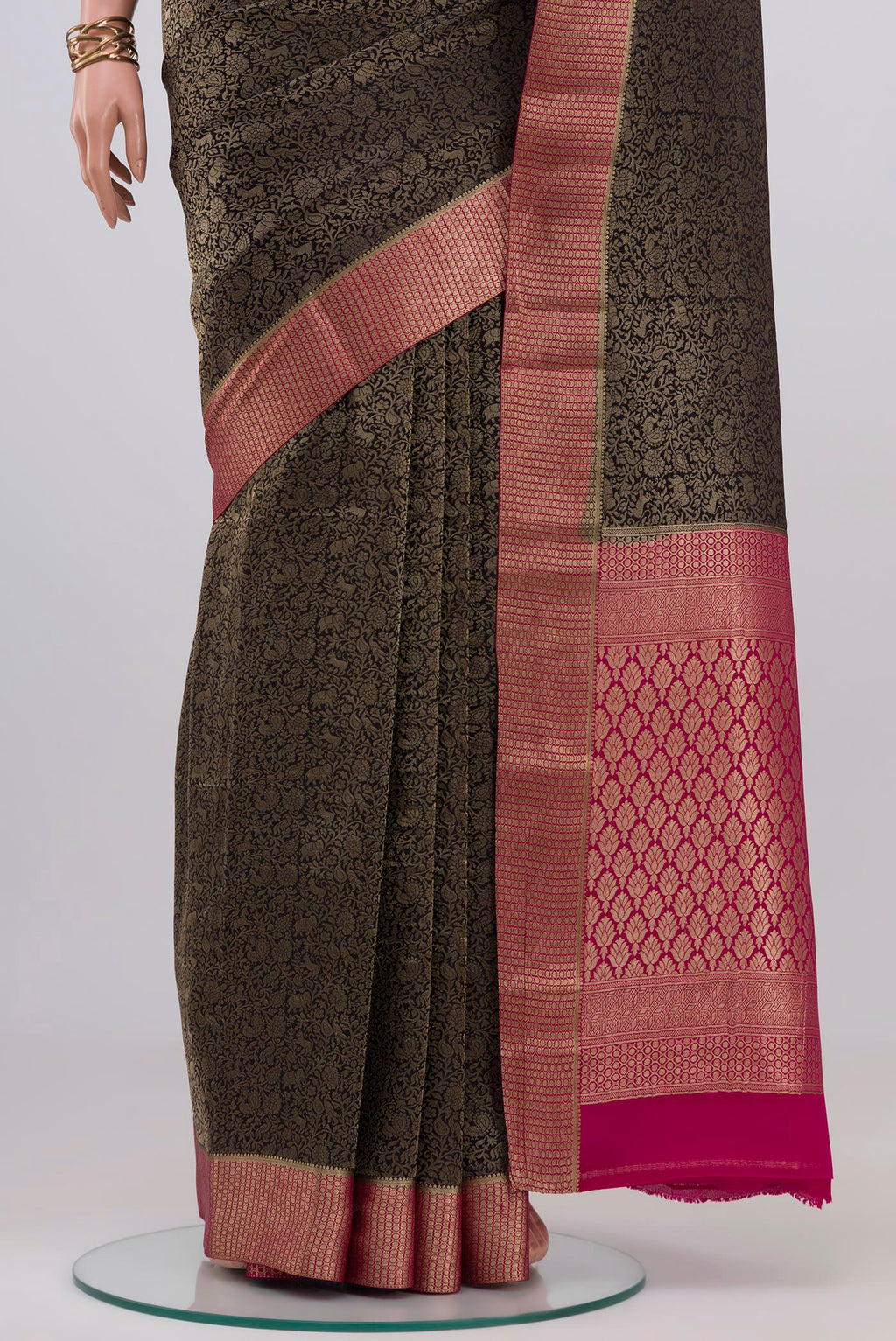 Pleats and pallu of Black Mysore Crepe Saree with Zari Brocade on the body and Zari Border. 