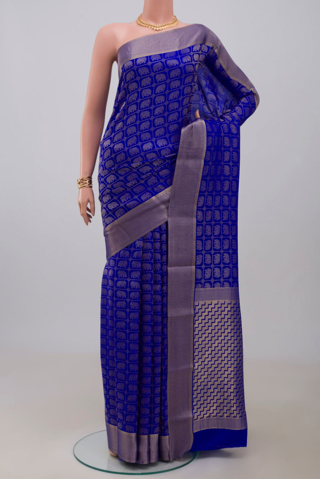 Royal Blue Mysore Crepe Saree with Zari Brocade on the body and Zari Border.  displayed on a mannequin