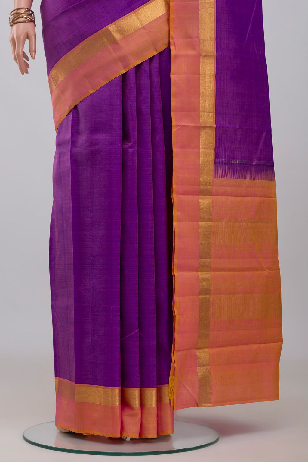 Pleats and pallu of Purple Kanjivaram Silk Saree with Plain Body and Zari Border. 