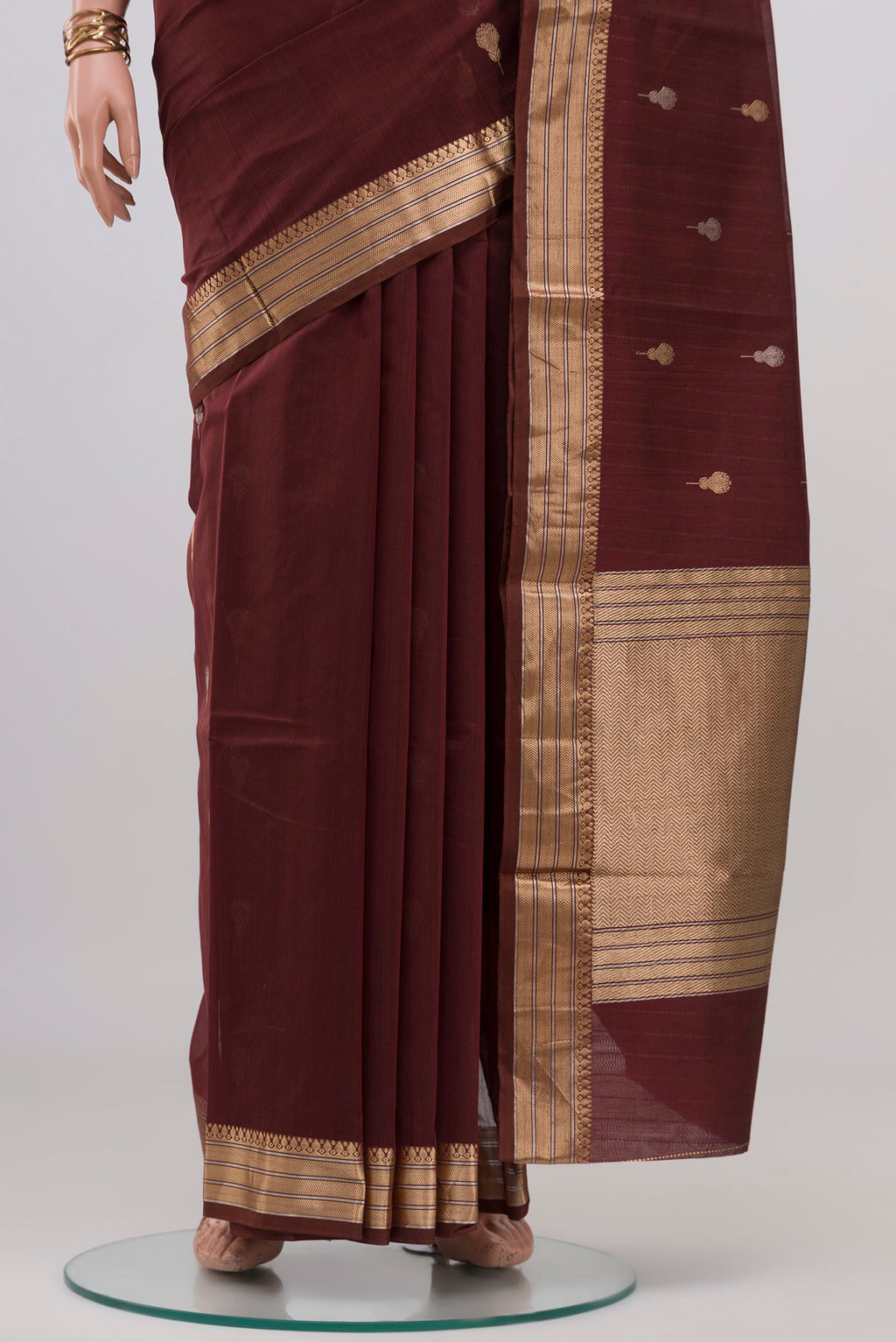 Pleats and pallu of Coffee Brown Banarasi Kora Cotton Saree with Zari Butta on the body and Zari Border. 
