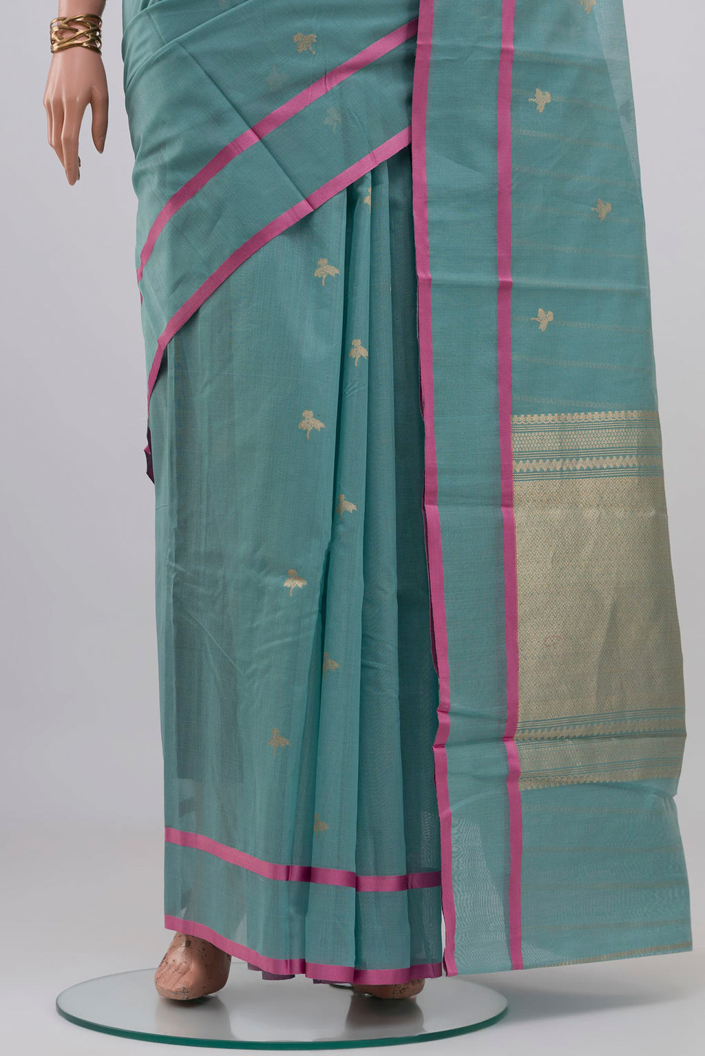 Pleats and pallu of Blue Kora Cotton Saree with Zari Butta on the body and Thin Zari Line. 