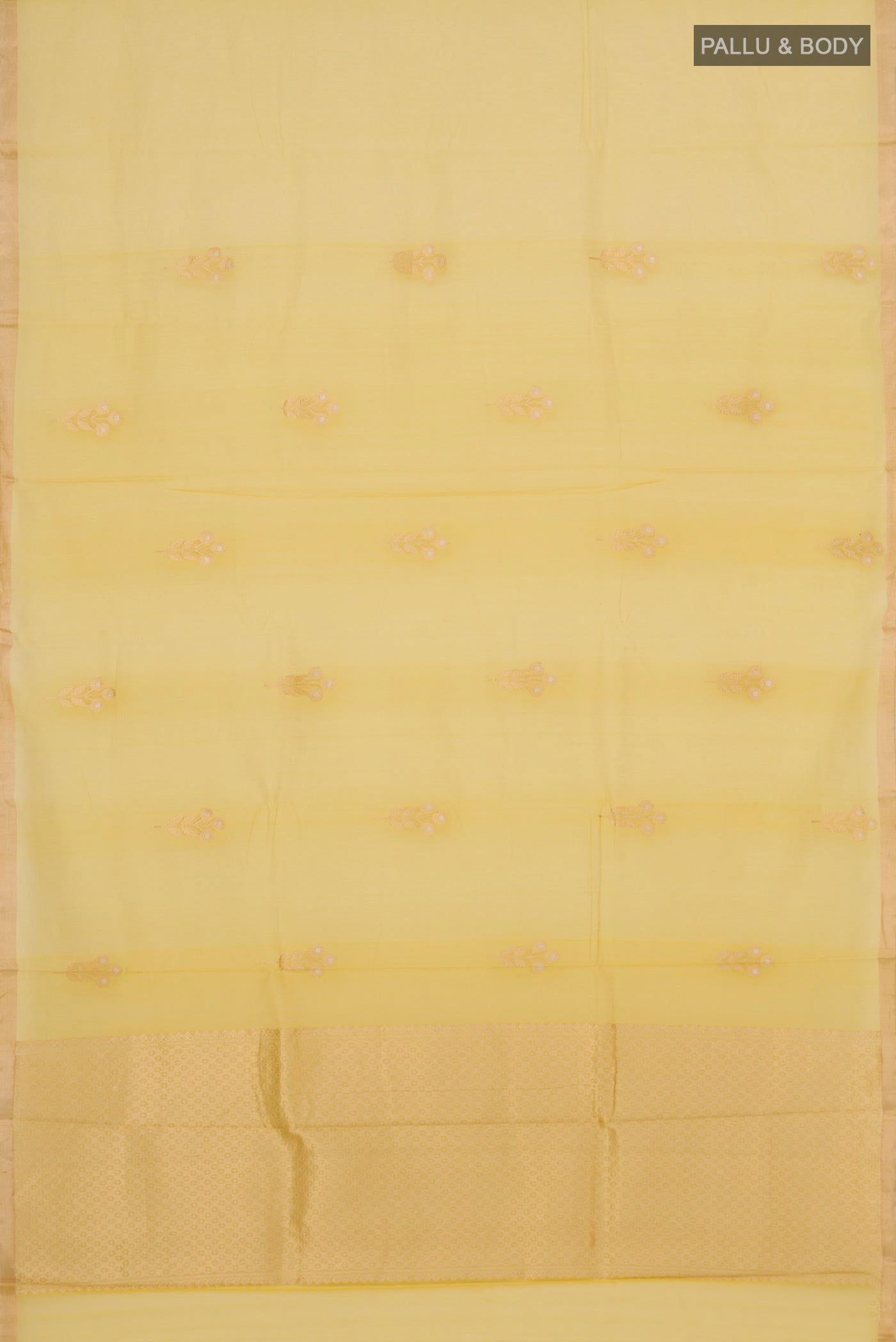 Flat view of Lemon Yellow Kora Cotton Saree with Zari Butta on the body and Thin Zari Line. 