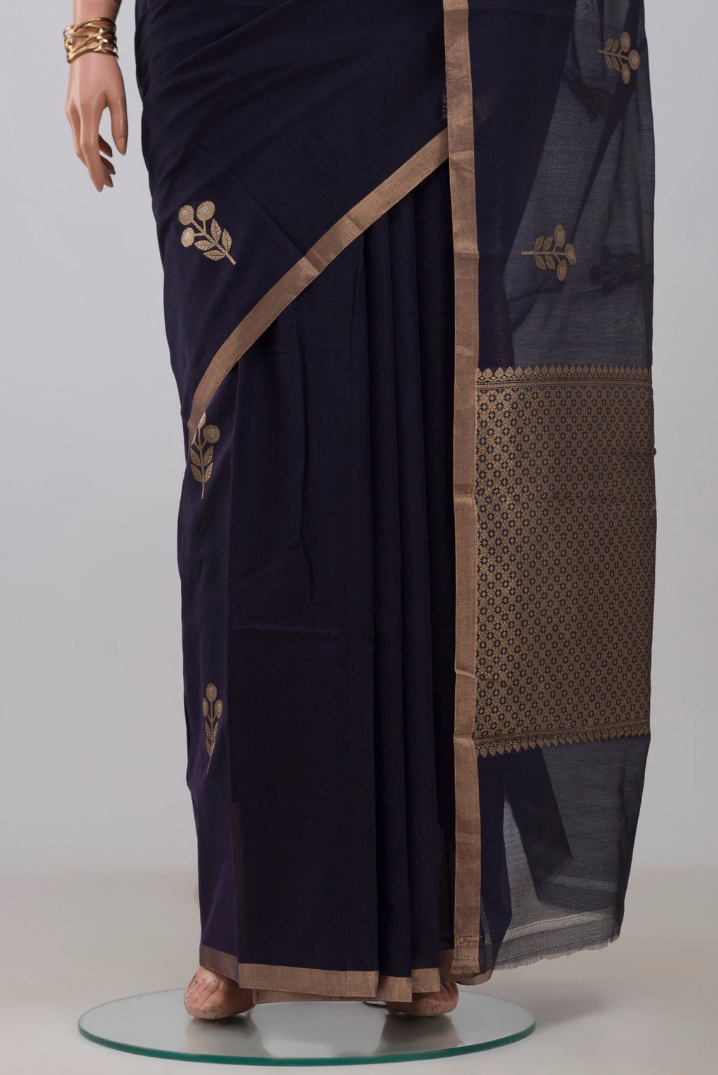 Pleats and pallu of Navy Blue Banarasi Kora Cotton Saree with Zari Butta on the body and Zari Border. 