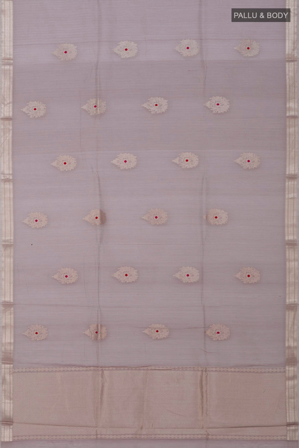 Flat view of Grey Banarasi Kora Cotton Saree with Zari Butta on the body and Zari Border. 