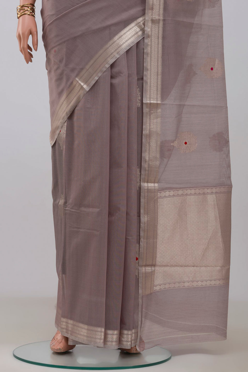 Pleats and pallu of Grey Banarasi Kora Cotton Saree with Zari Butta on the body and Zari Border. 