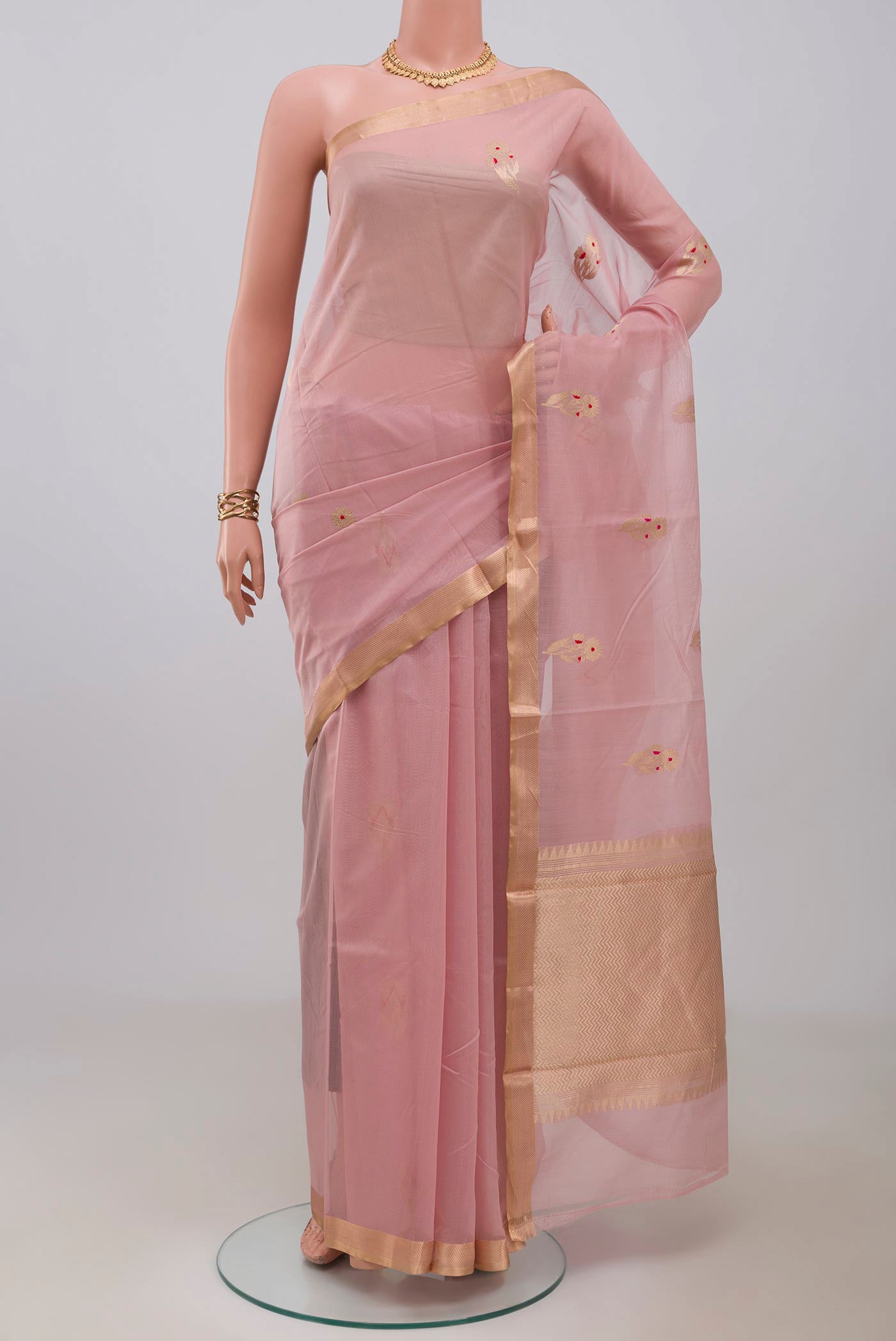 Pink Banarasi Kora Cotton Saree with Zari Butta on the body and Zari Border.  displayed on a mannequin