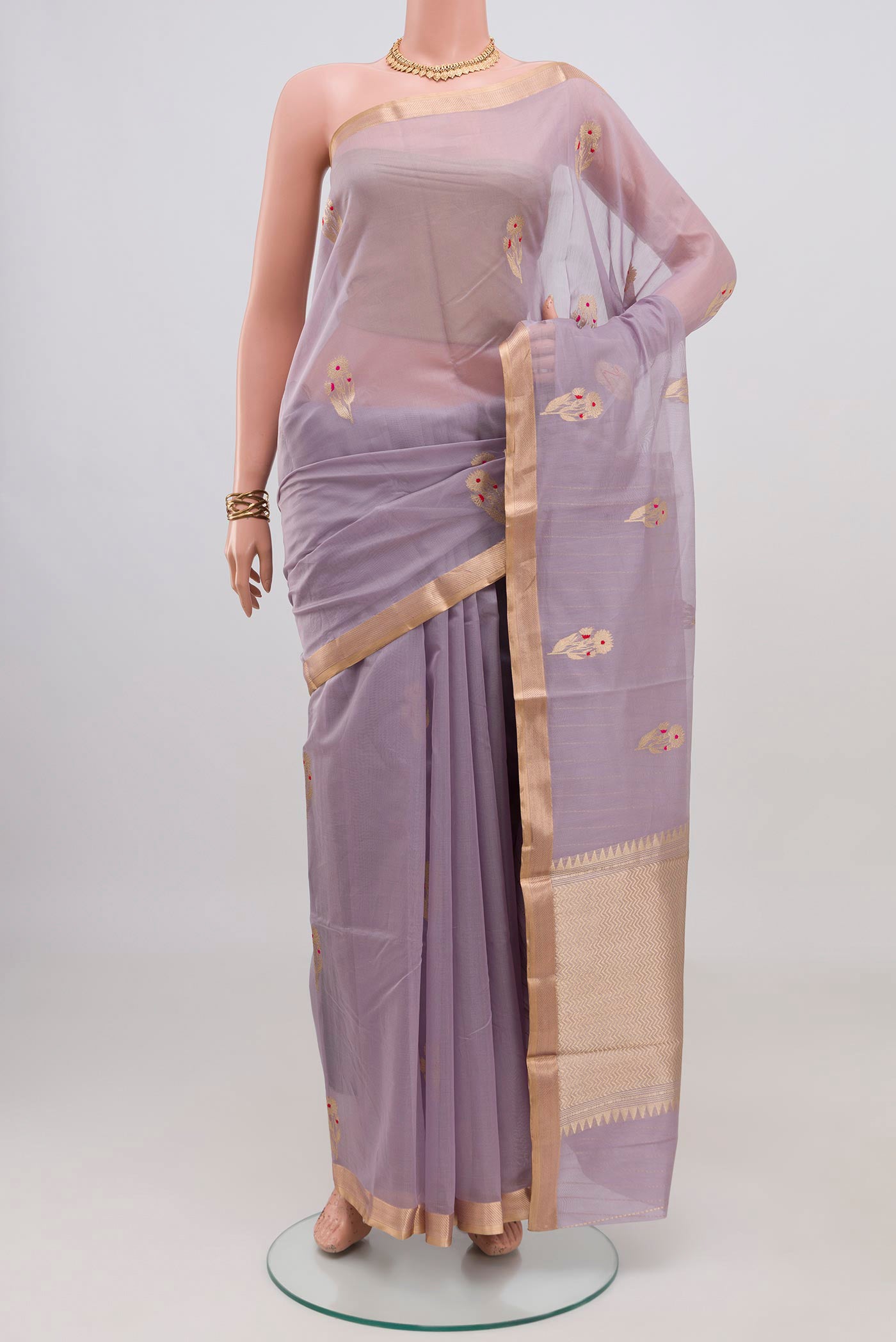 Lavender Banarasi Kora Cotton Saree with Zari Butta on the body and Zari Border.  displayed on a mannequin