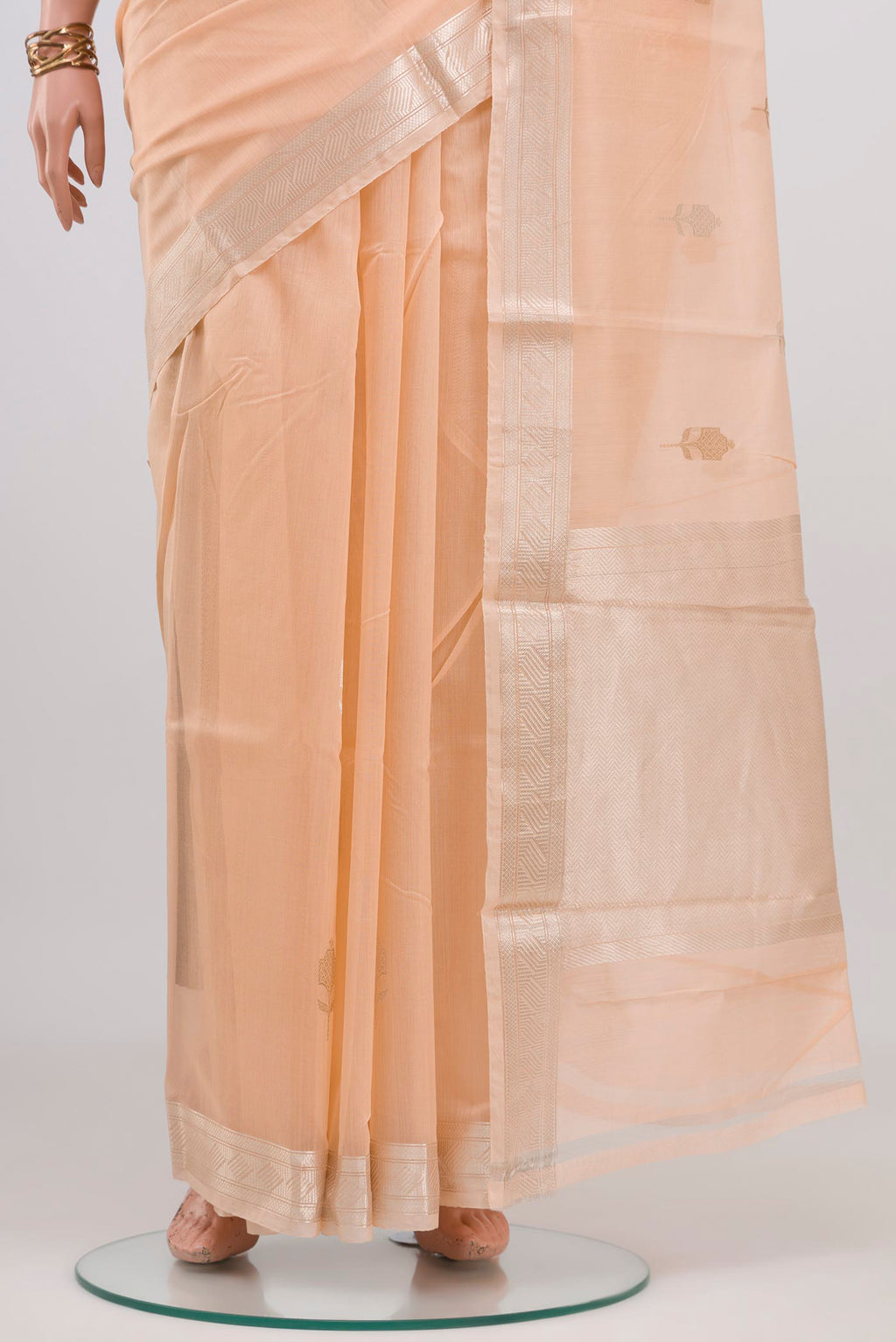 Pleats and pallu of Peach Chanderi Silk Cotton Saree with Zari Butta on the body and Zari Border. 