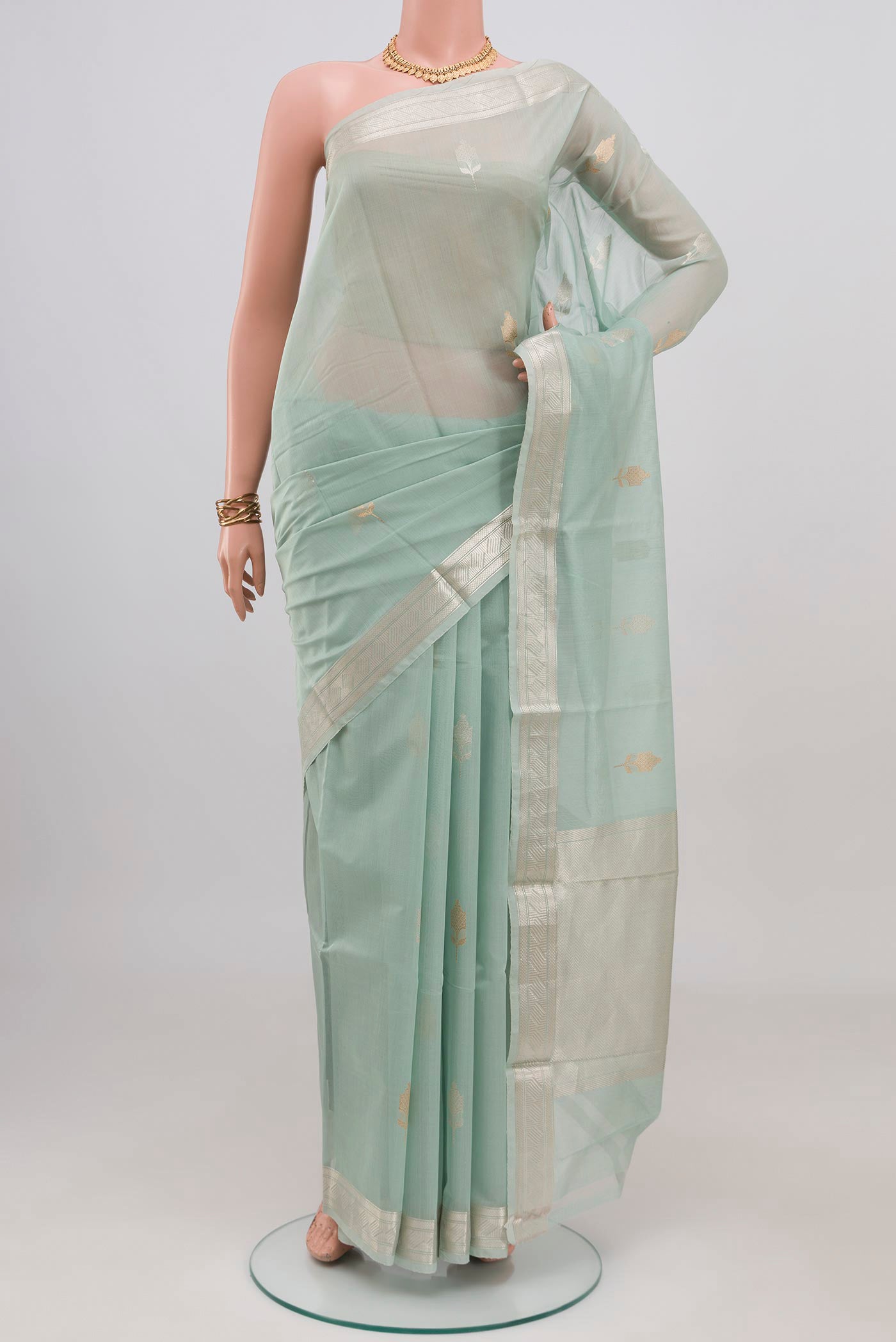 Light Blue Chanderi Silk Cotton Saree with Zari Butta on the body and Zari Border.  displayed on a mannequin