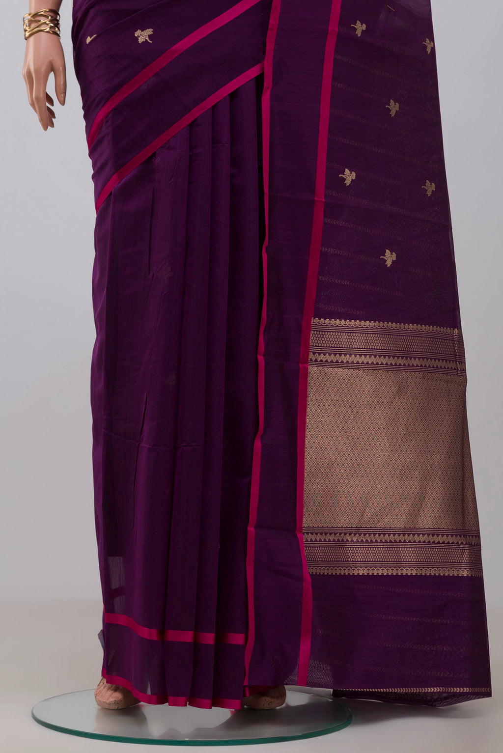 Pleats and pallu of Purple Banarasi Kora Cotton Saree with Zari Butta on the body and Plain Border. 