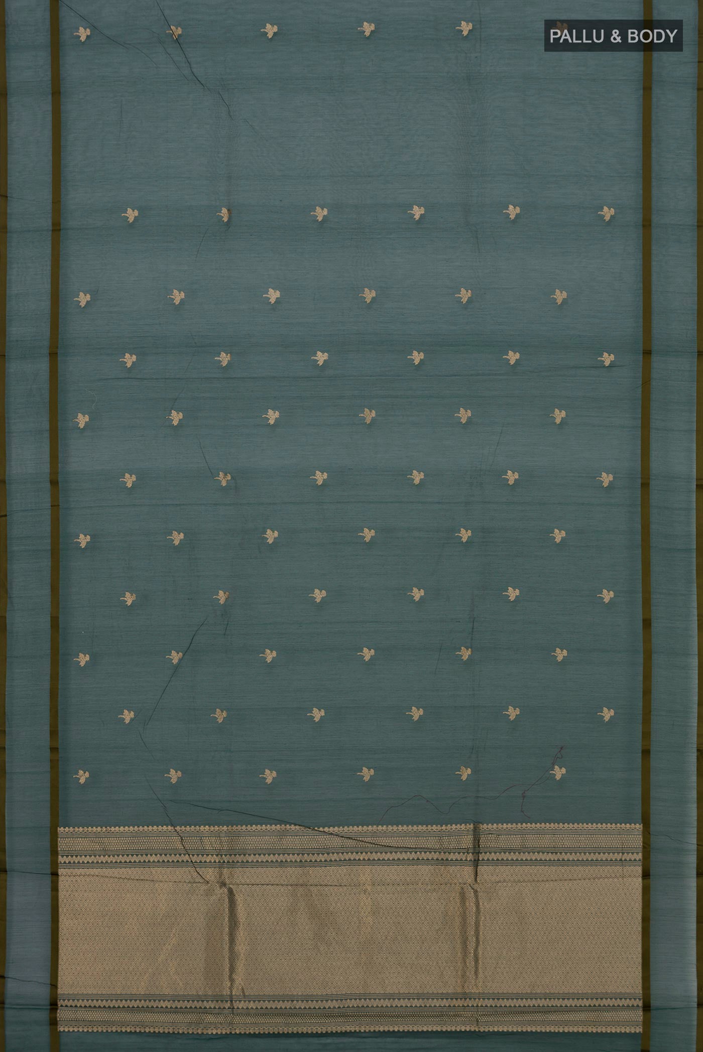 Flat view of Bottle Green Kora Cotton Saree with Zari Butta on the body and Thin Zari Line. 