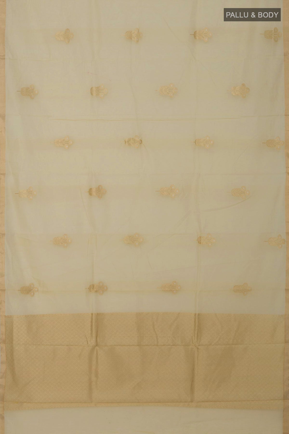 Flat view of Cream Banarasi Kora Cotton Saree with Zari Butta on the body and Zari Border. 