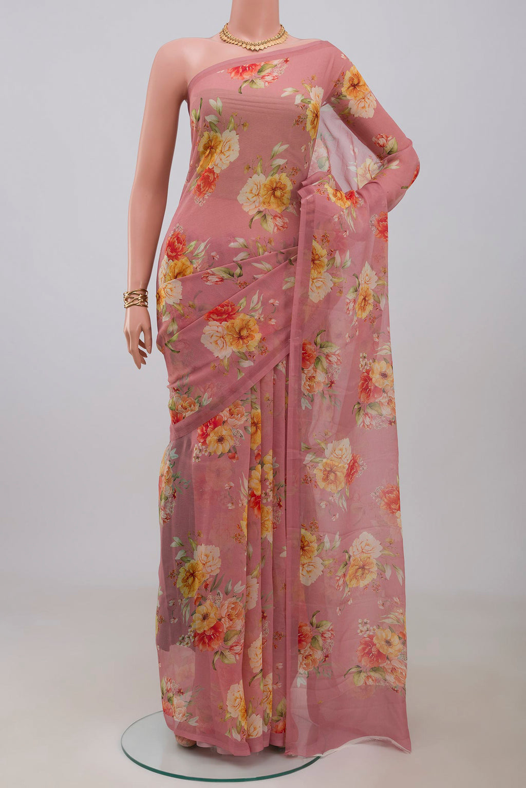 Pink Chiffon Saree with Printed design on the body and Without Border.  displayed on a mannequin