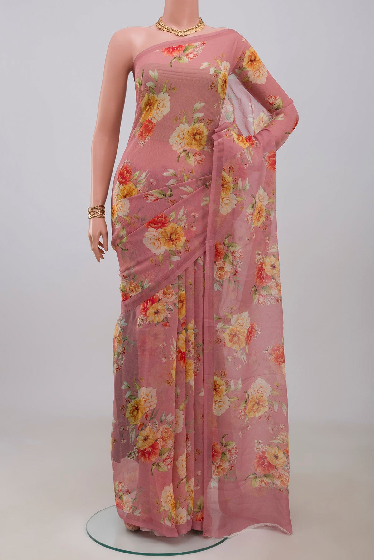 Pink Chiffon Saree with Printed design on the body and Without Border.  displayed on a mannequin