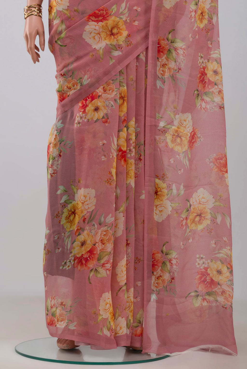 Pleats and pallu of Pink Chiffon Saree with Printed design on the body and Without Border. 