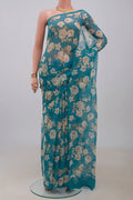 Blue Chiffon Saree with Printed design on the body and Without Border.  displayed on a mannequin