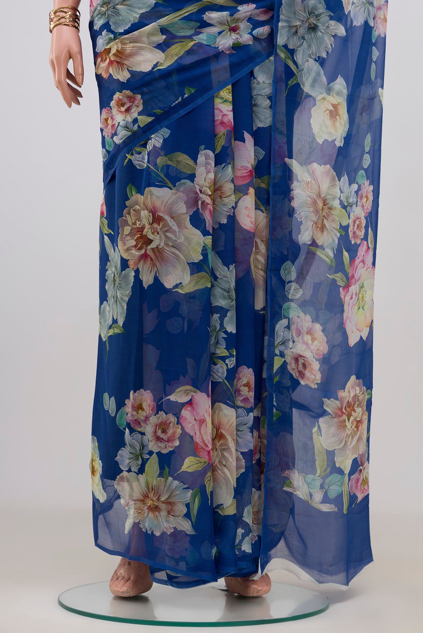 Pleats and pallu of Royal Blue Mysore Chiffon Saree with Floral Print on the body and Without Border. 