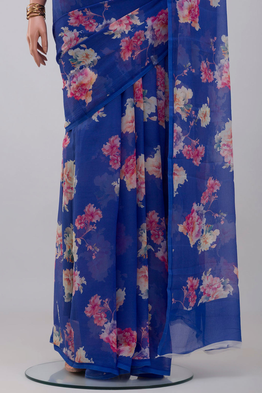 Pleats and pallu of Royal Blue Chiffon Saree with Floral Print on the body and Without Border. 
