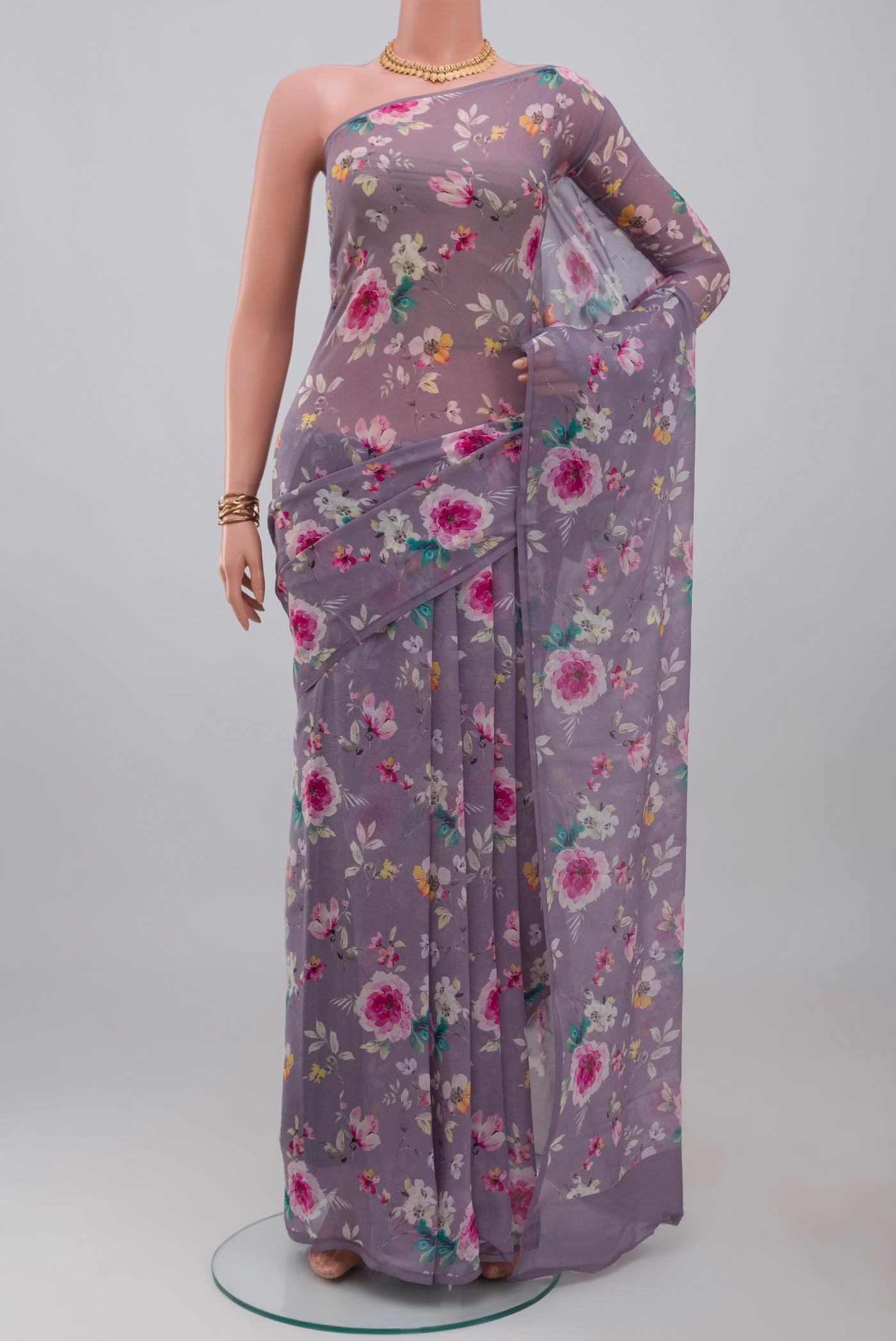 Grey Mysore Chiffon Saree with Floral Print on the body and Without Border.  displayed on a mannequin