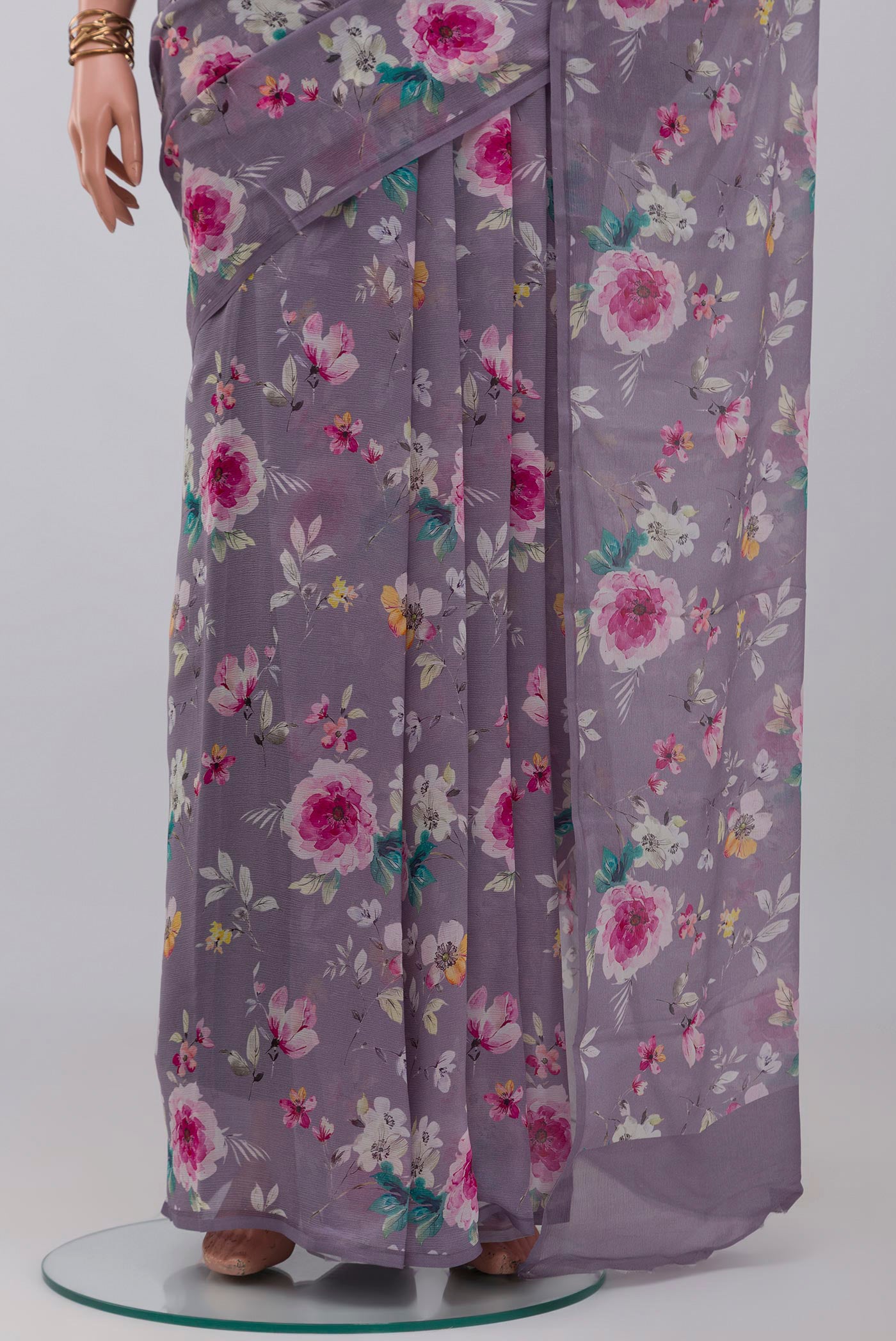 Pleats and pallu of Grey Mysore Chiffon Saree with Floral Print on the body and Without Border. 