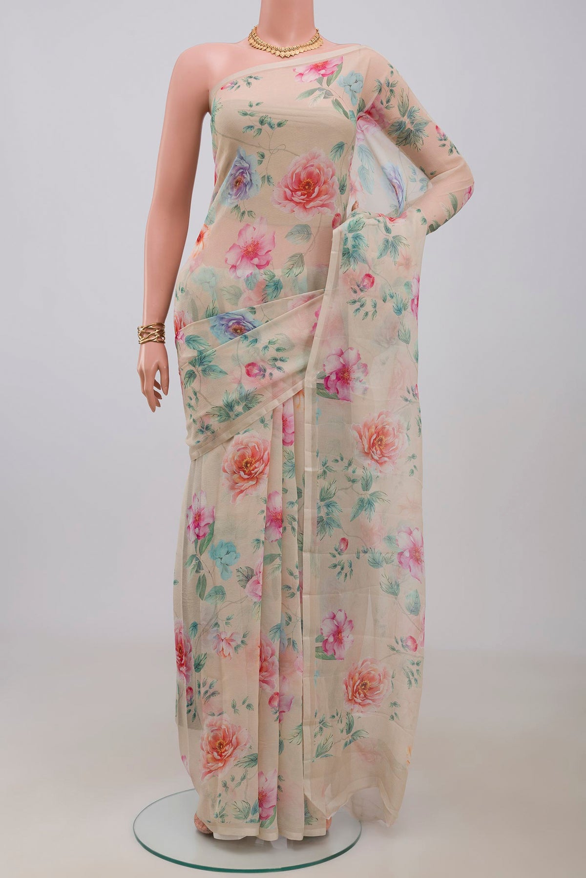 Beige Chiffon Saree with Printed design on the body and Without Border.  displayed on a mannequin