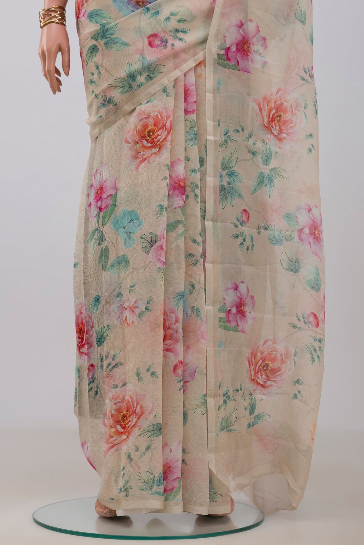 Pleats and pallu of Beige Chiffon Saree with Printed design on the body and Without Border. 