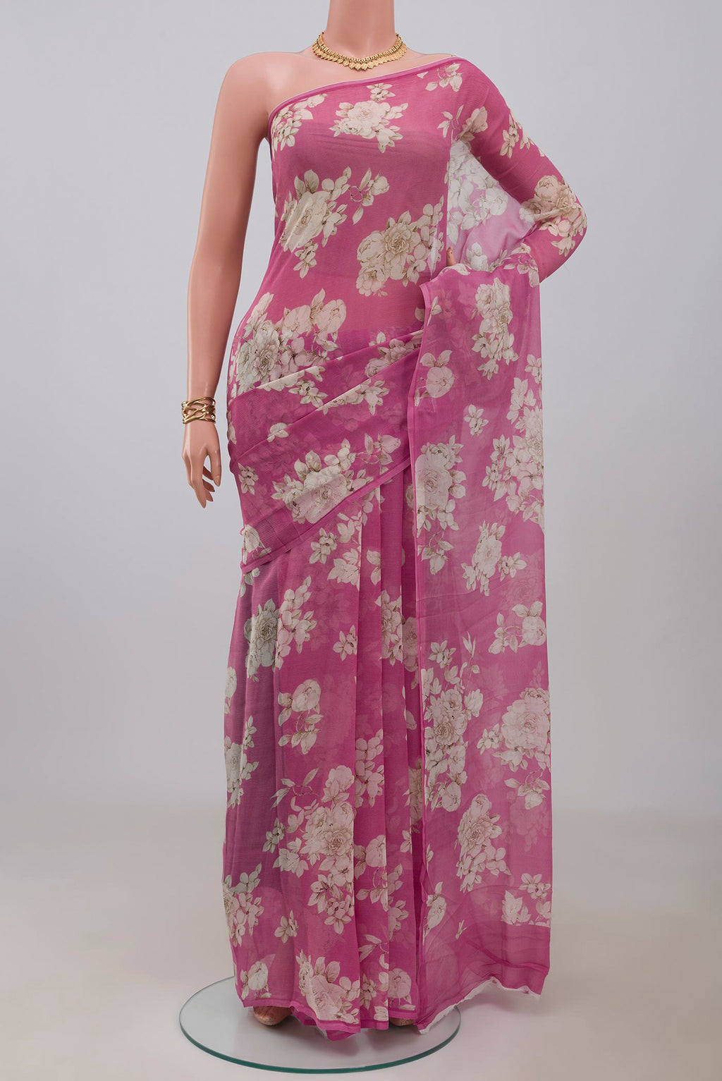Pink Chiffon Saree with Printed design on the body and Without Border.  displayed on a mannequin