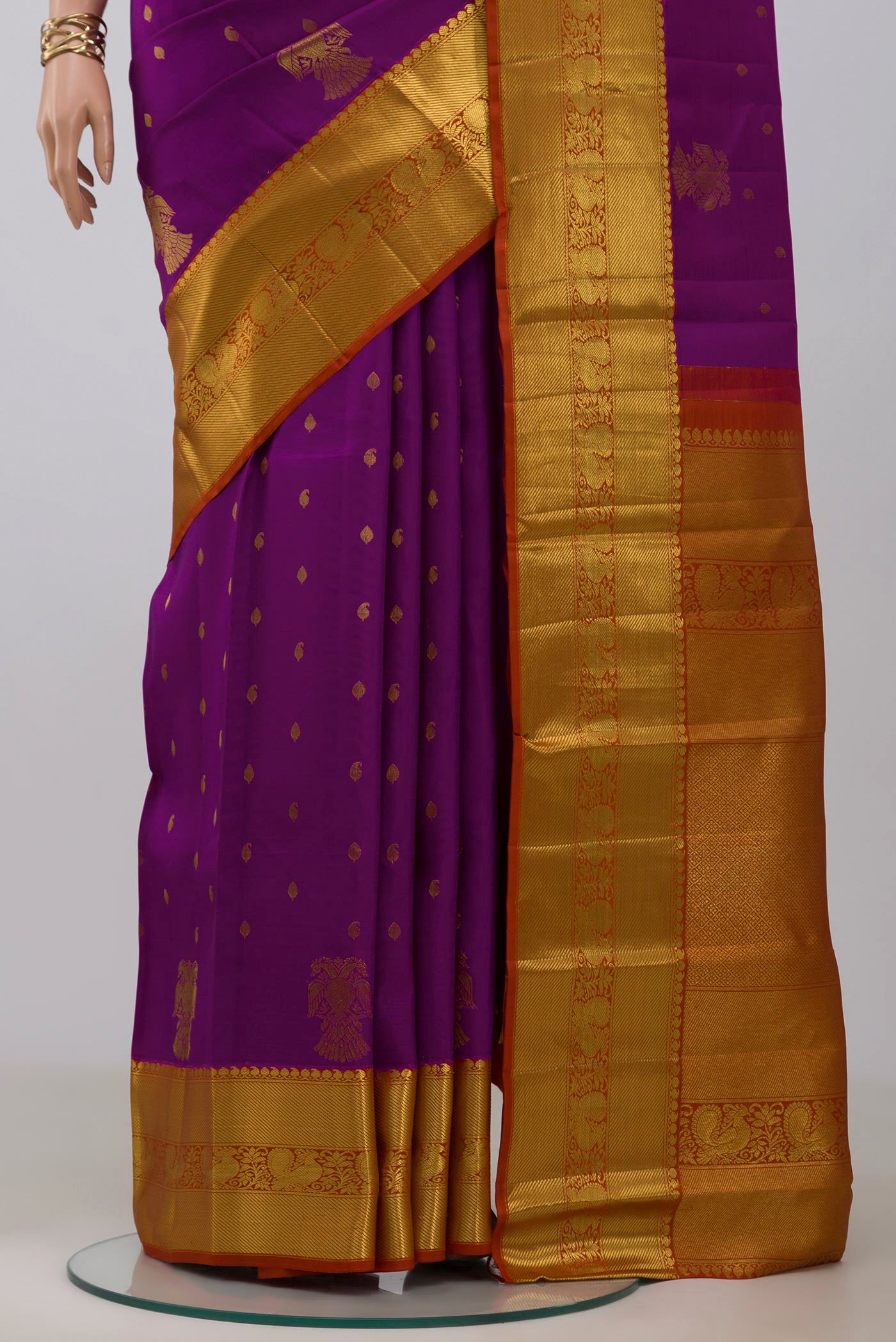 Pleats and pallu of Magenta Kanjivaram Saree with Zari Butta on the body and Zari Border. 