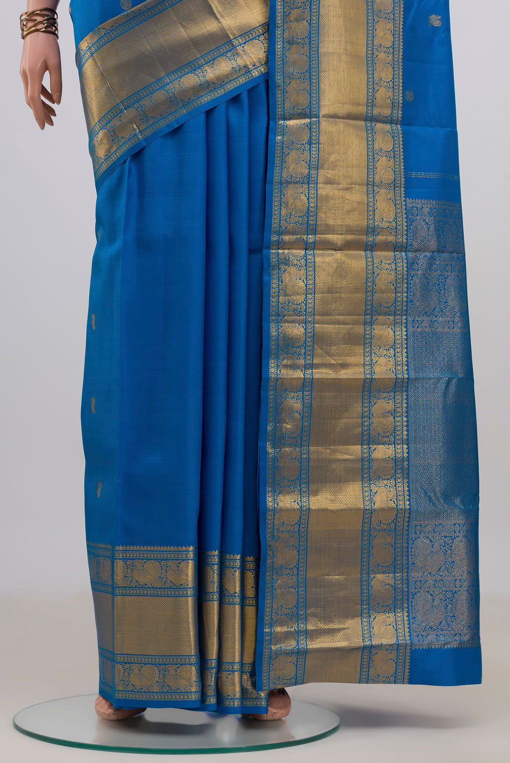 Pleats and pallu of Pure Silk Blue Kanjivaram Saree with Zari Butta on the body and Zari Border. 