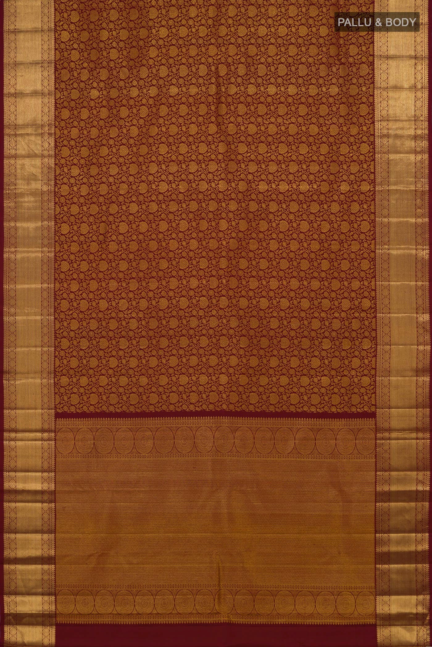 Flat view of Maroon Kanchipuram Silk Saree with Zari Brocade on the body and Zari Border. 