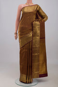Brown Kanchipuram Silk Saree with Zari Brocade on the body and Zari Border.  displayed on a mannequin