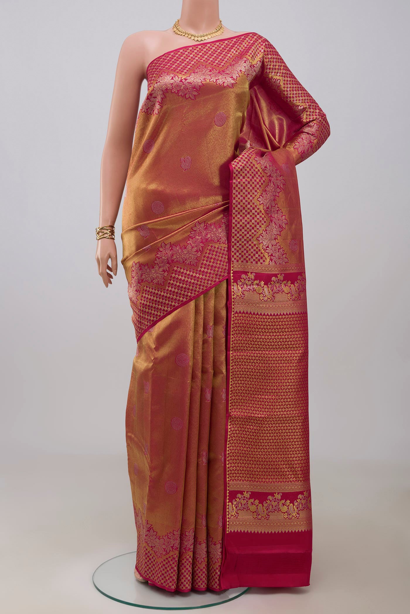 Gold Dual Tone Kanchipuram Silk Saree with Zari Brocade on the body and Fancy Border.  displayed on a mannequin