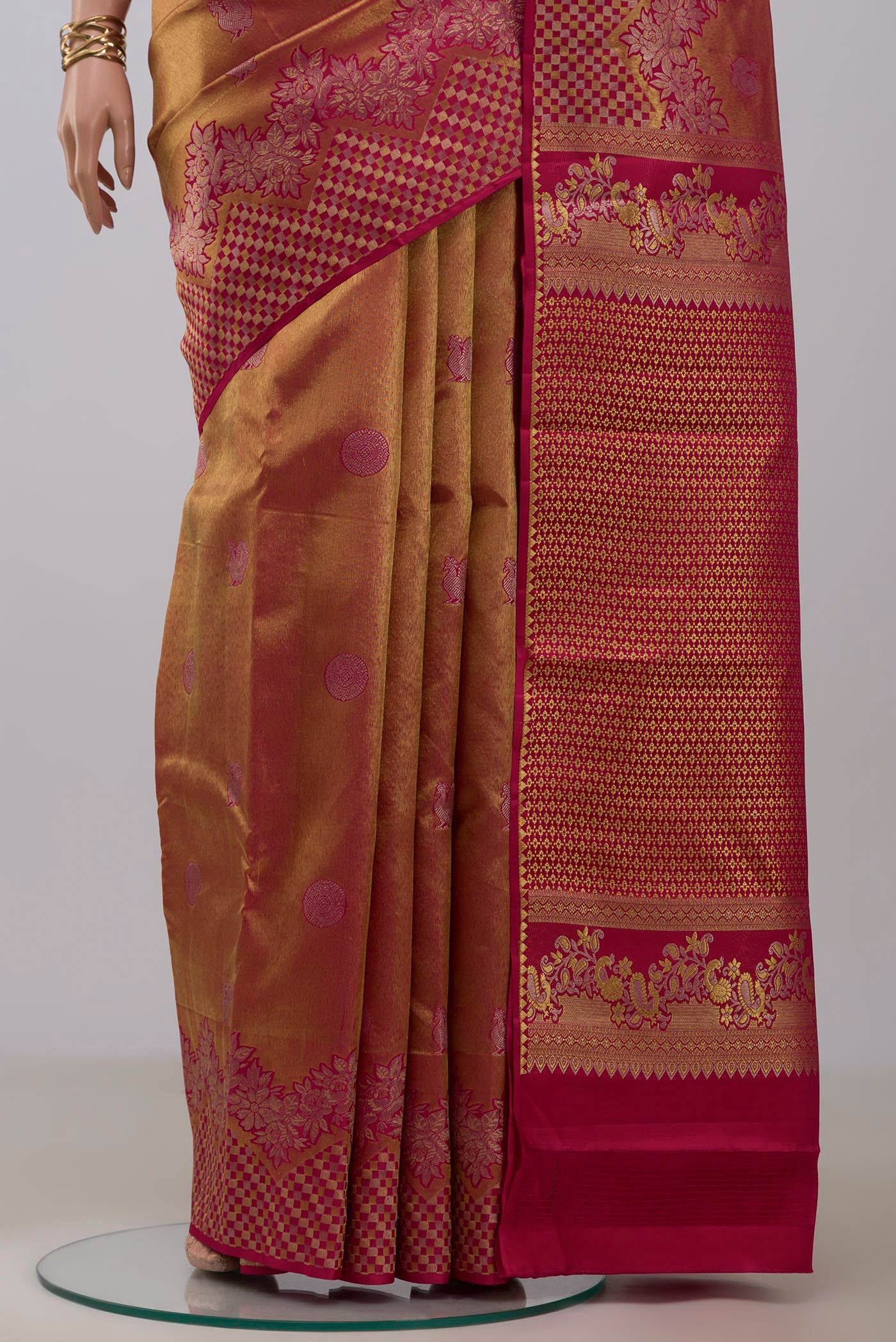 Pleats and pallu of Gold Dual Tone Kanchipuram Silk Saree with Zari Brocade on the body and Fancy Border. 