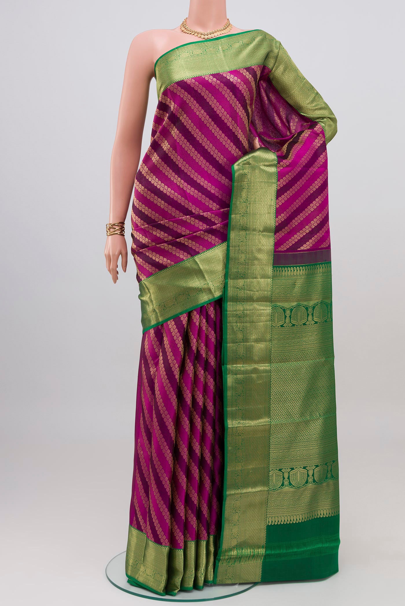Purple Kanchipuram Silk Saree with Zari Brocade on the body and Zari Border.  displayed on a mannequin