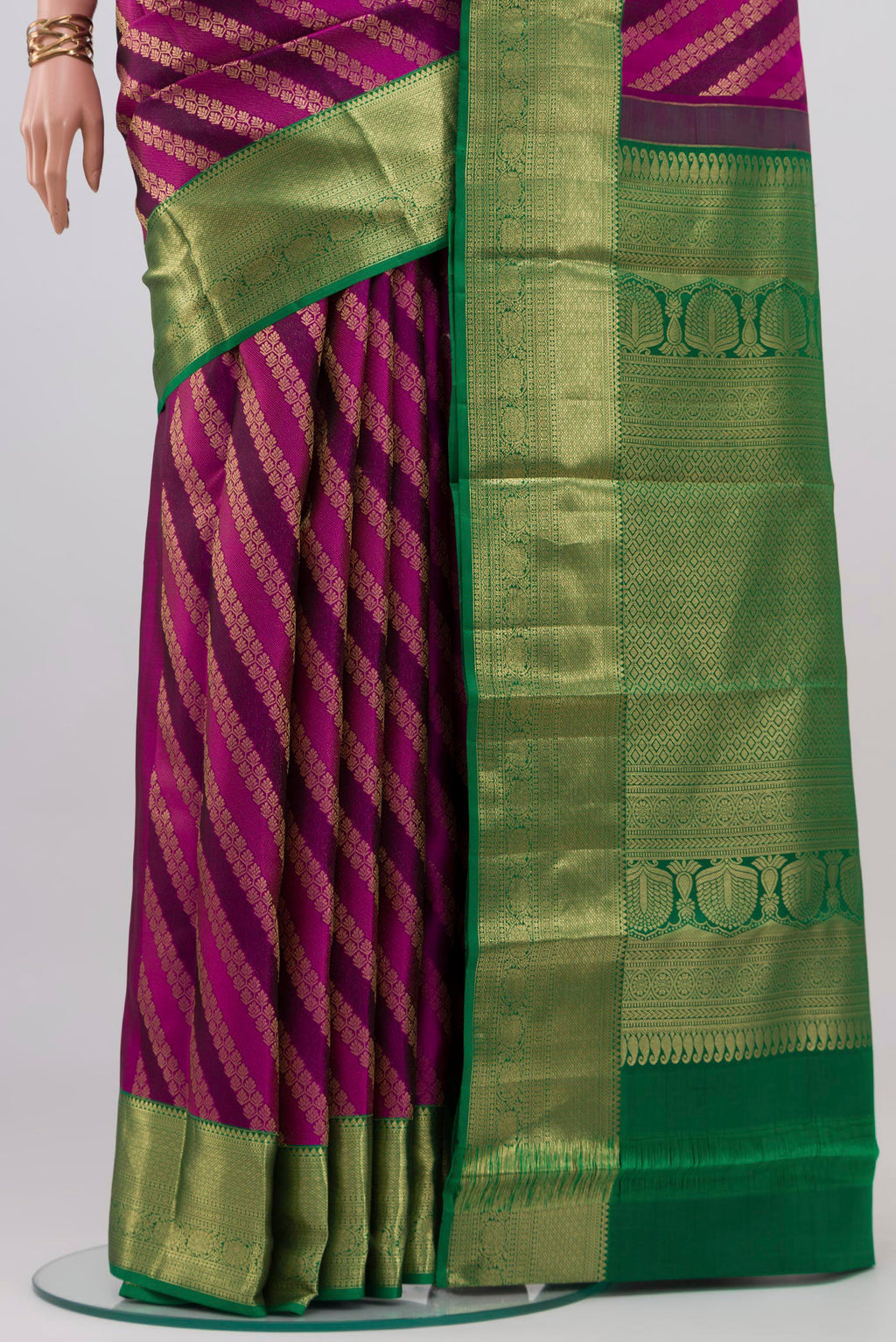 Pleats and pallu of Purple Kanchipuram Silk Saree with Zari Brocade on the body and Zari Border. 