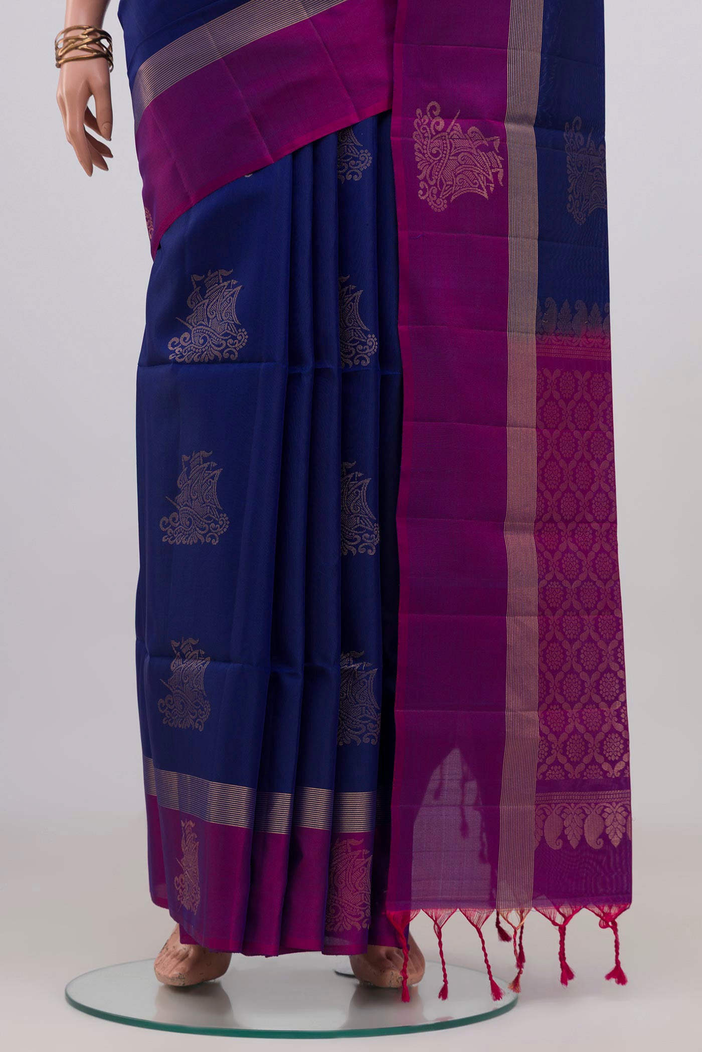 Pleats and pallu of Blue Soft Silk Saree with Zari Butta on the body and Thin Zari Line. 