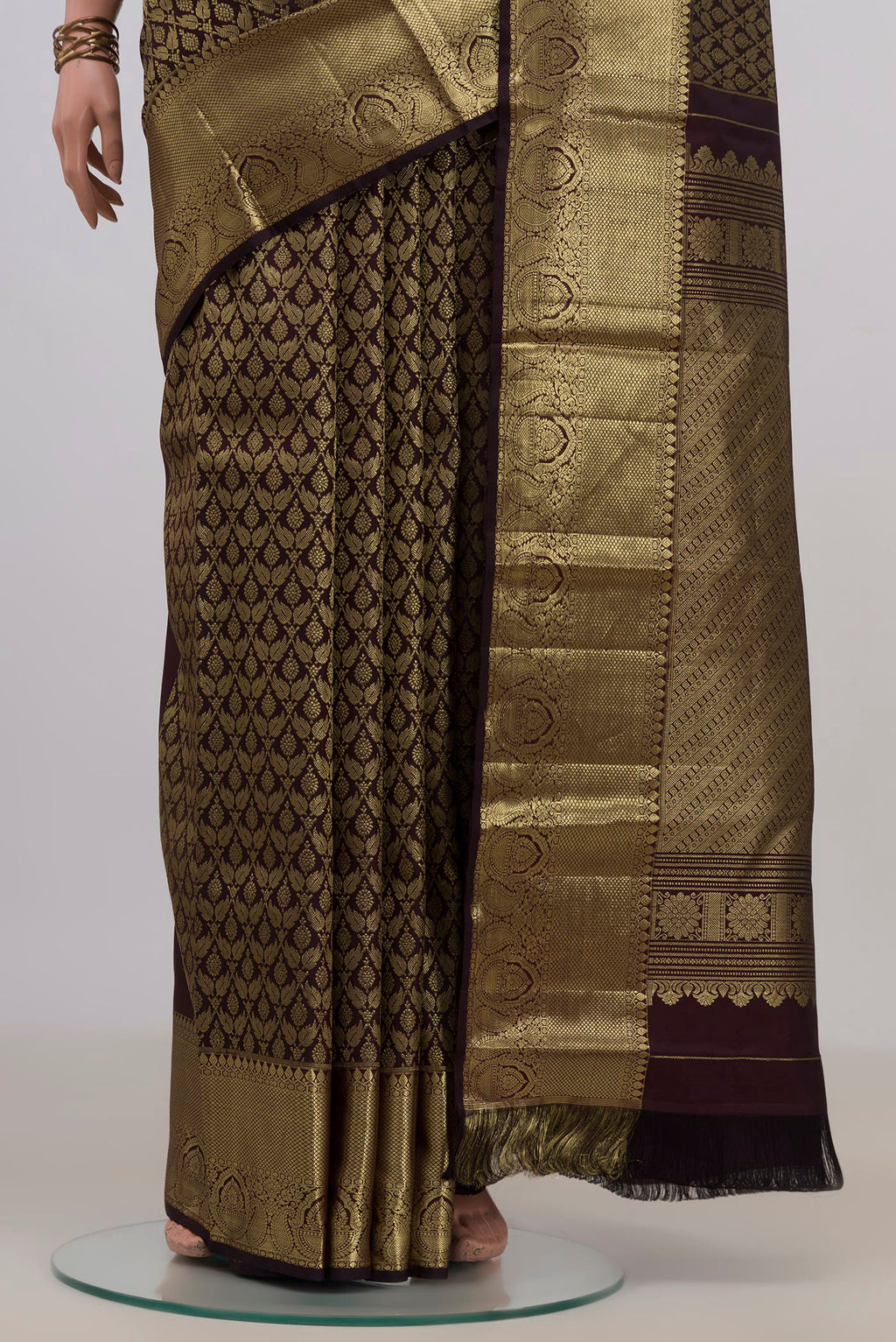 Pleats and pallu of Pure Silk Coffee Brown Kanjivaram Saree with Zari Brocade on the body and Zari Border. 