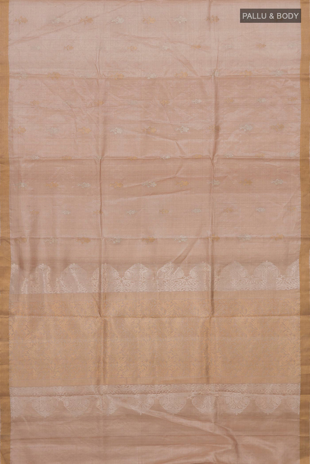 Flat view of Beige Tussar Silk Saree with Zari Butta on the body and Thin Zari Line. 