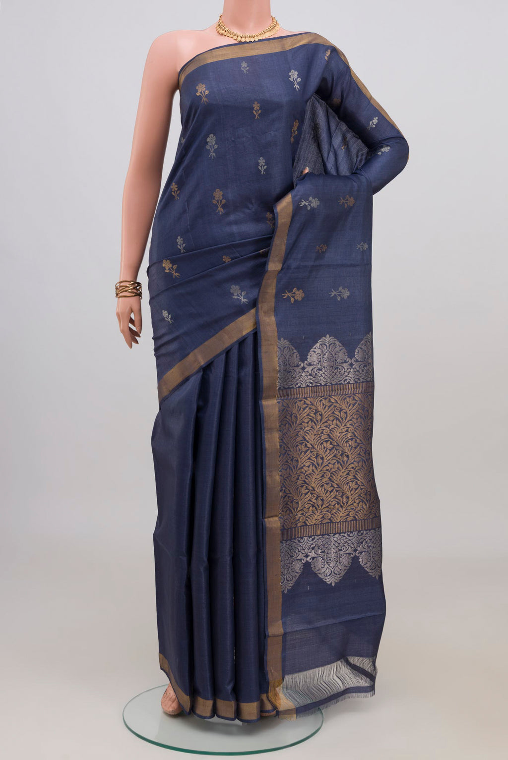 Blue Grey Tussar Silk Saree with Zari Butta on the body and Zari Border.  displayed on a mannequin