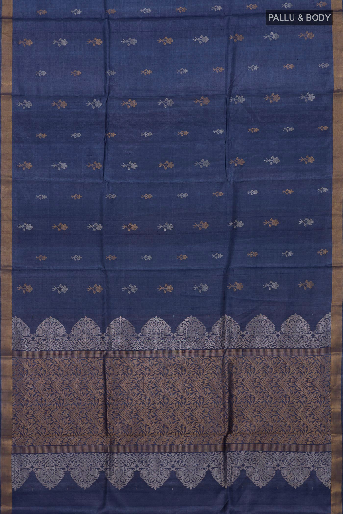 Flat view of Blue Grey Tussar Silk Saree with Zari Butta on the body and Zari Border. 