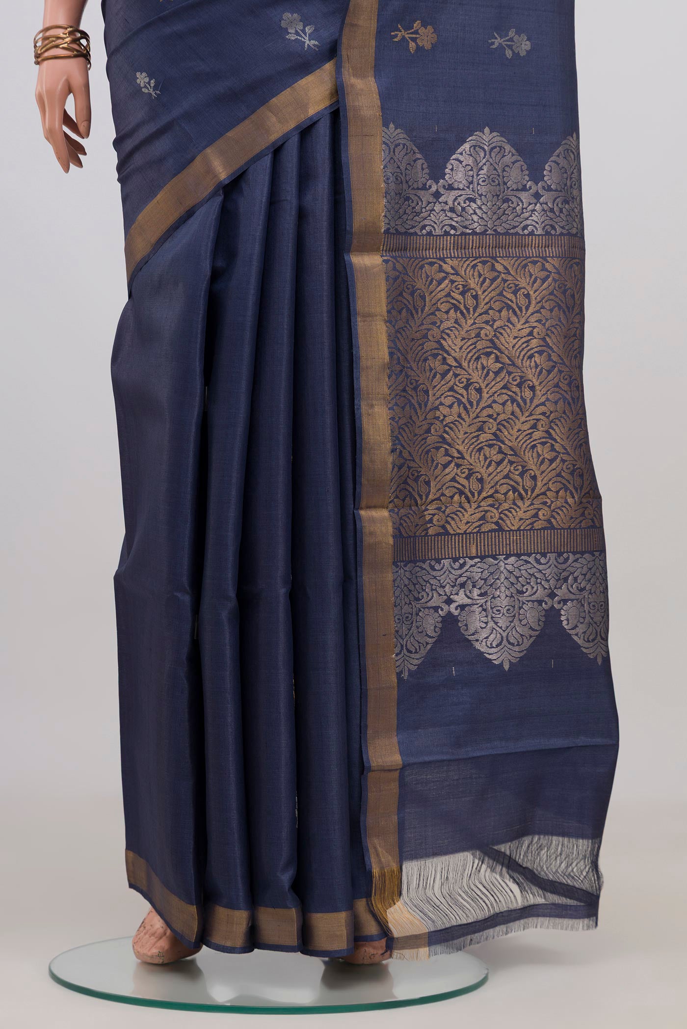 Pleats and pallu of Blue Grey Tussar Silk Saree with Zari Butta on the body and Zari Border. 