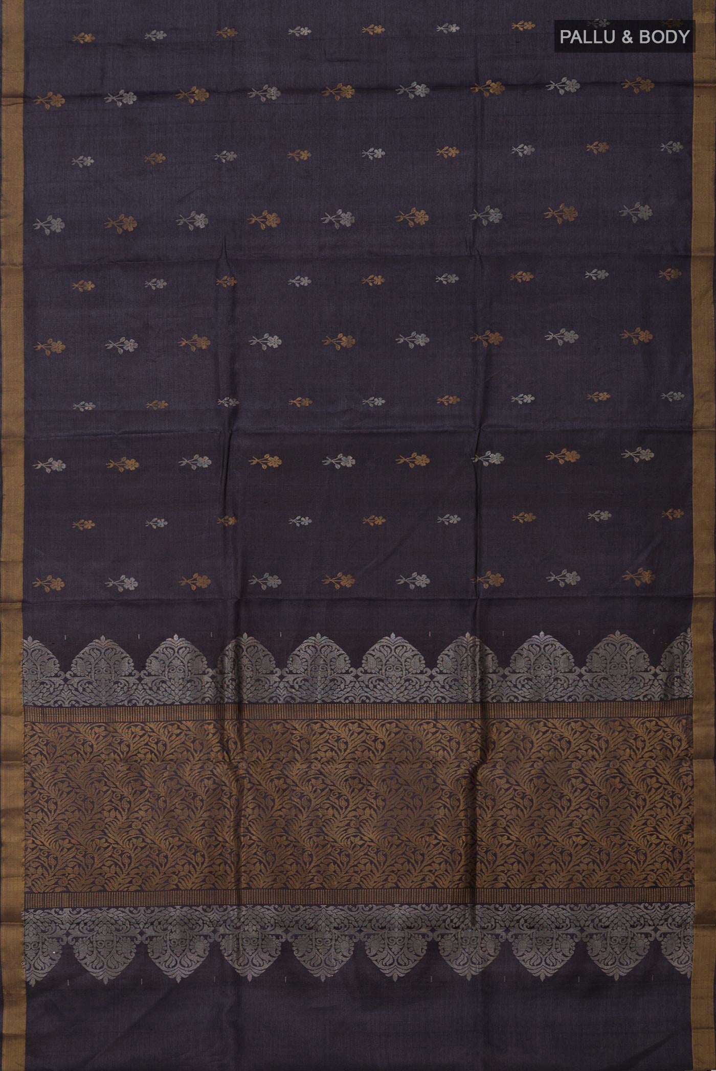 Flat view of Grey Tussar Silk Saree with Zari Butta on the body and Zari Border. 