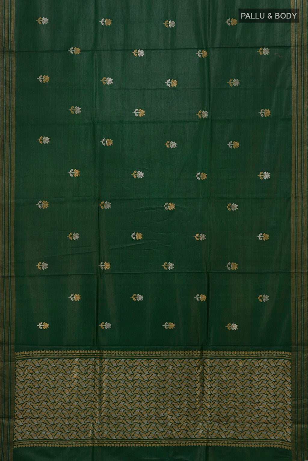 Flat view of Bottle Green Tussar Silk Saree with Zari Butta on the body and Zari Border. 