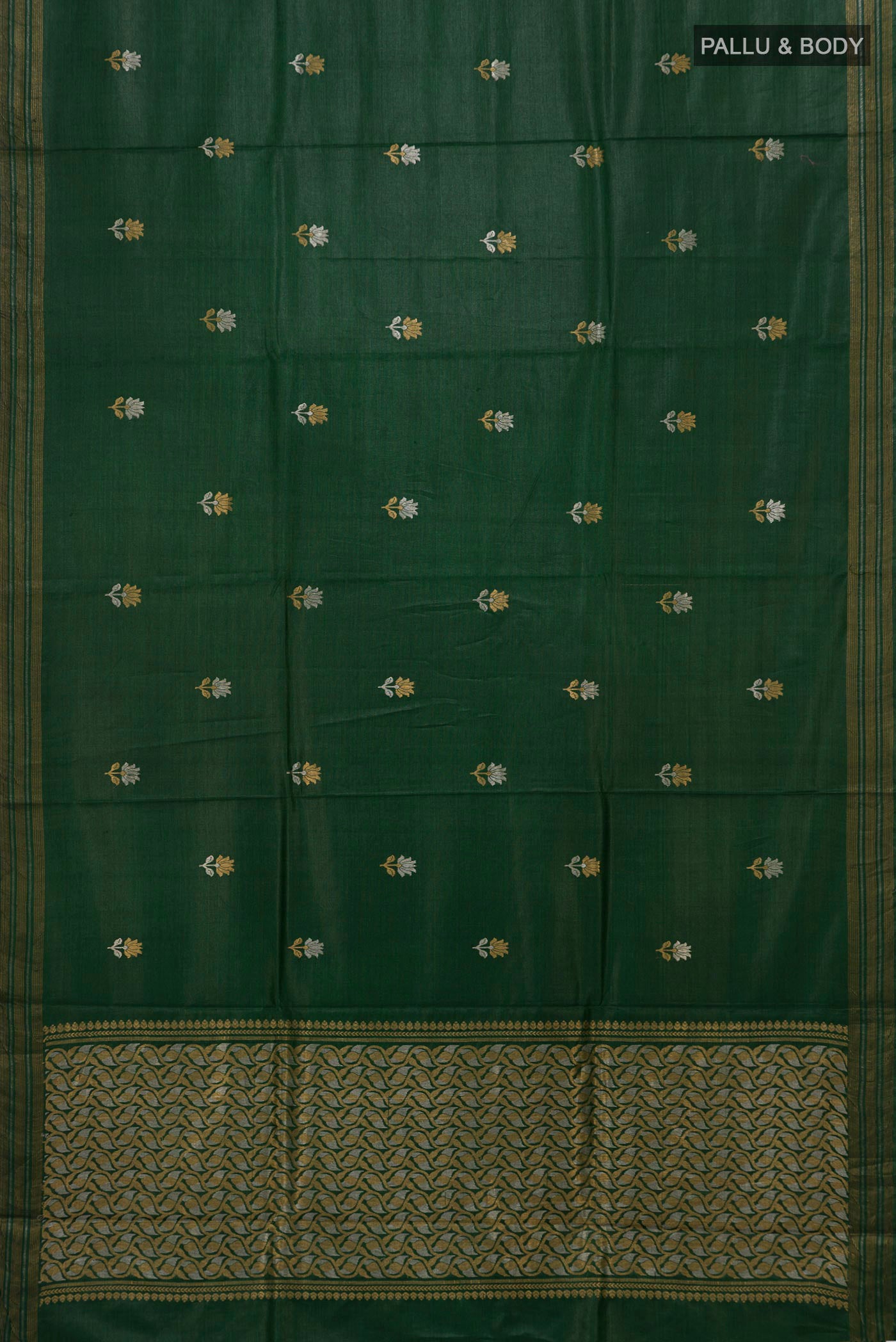 Flat view of Bottle Green Tussar Silk Saree with Zari Butta on the body and Zari Border. 
