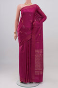 Magenta Tussar Silk Saree with Zari Butta on the body and Thin Zari Line.  displayed on a mannequin