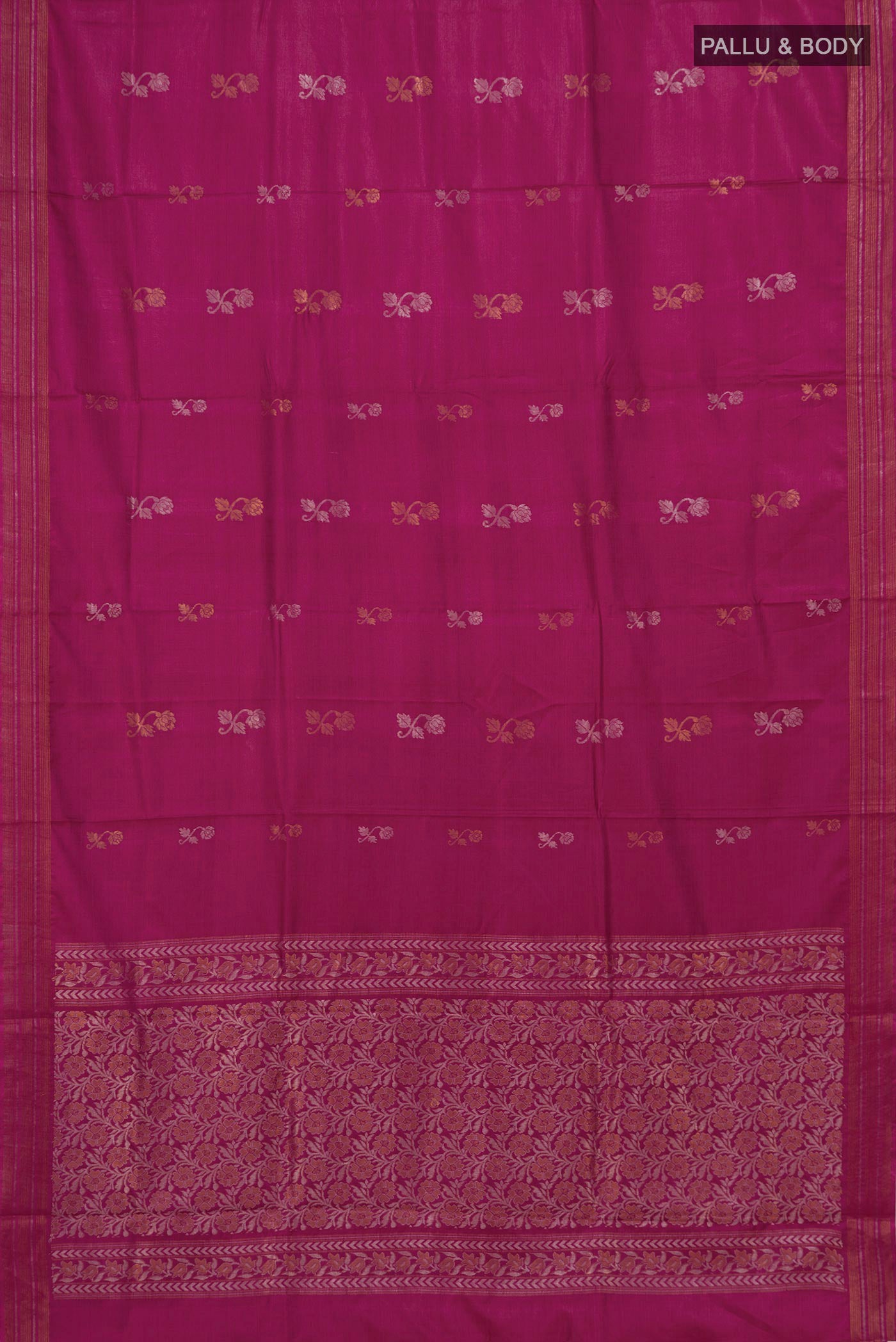 Flat view of Magenta Tussar Silk Saree with Zari Butta on the body and Thin Zari Line. 