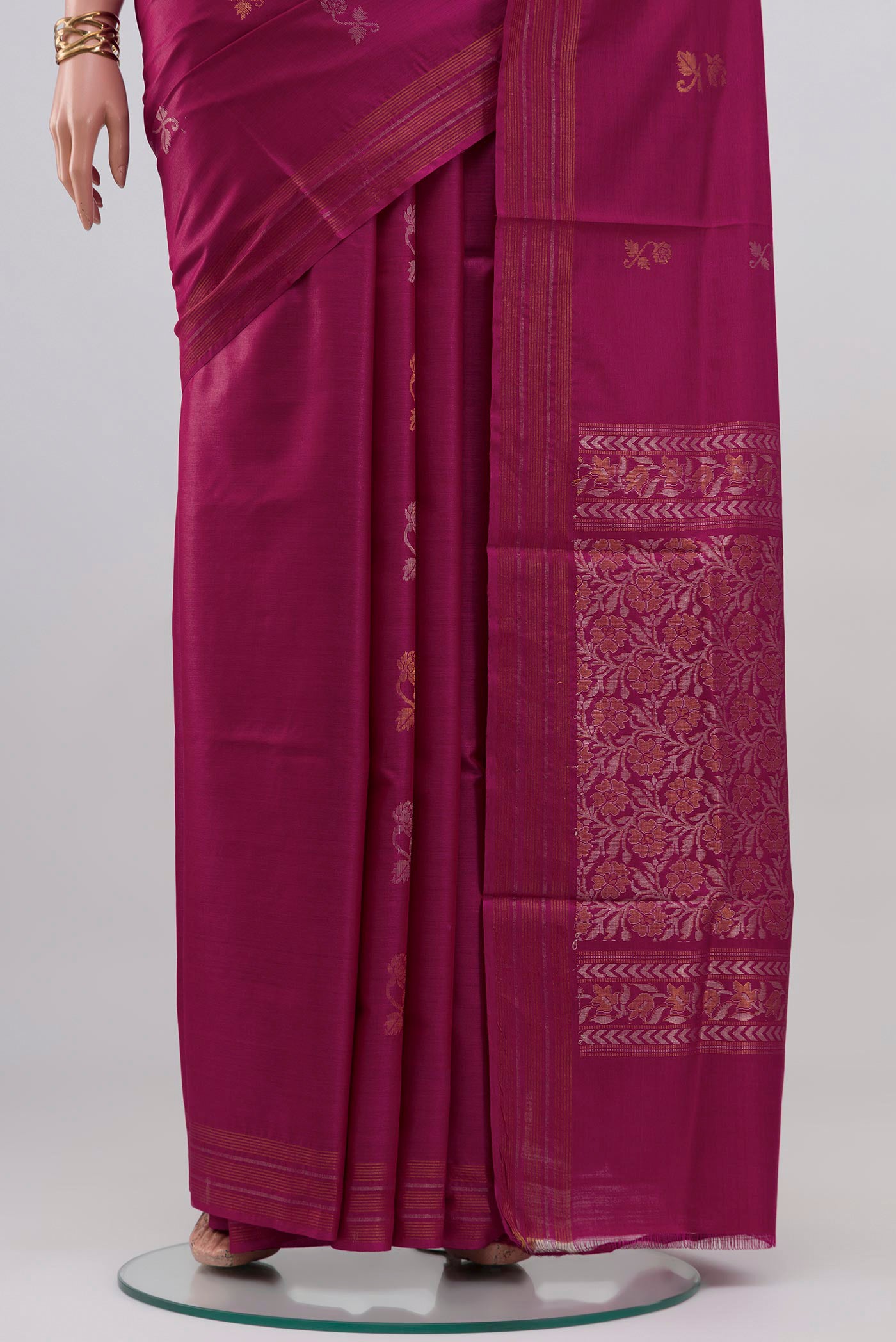 Pleats and pallu of Magenta Tussar Silk Saree with Zari Butta on the body and Thin Zari Line. 